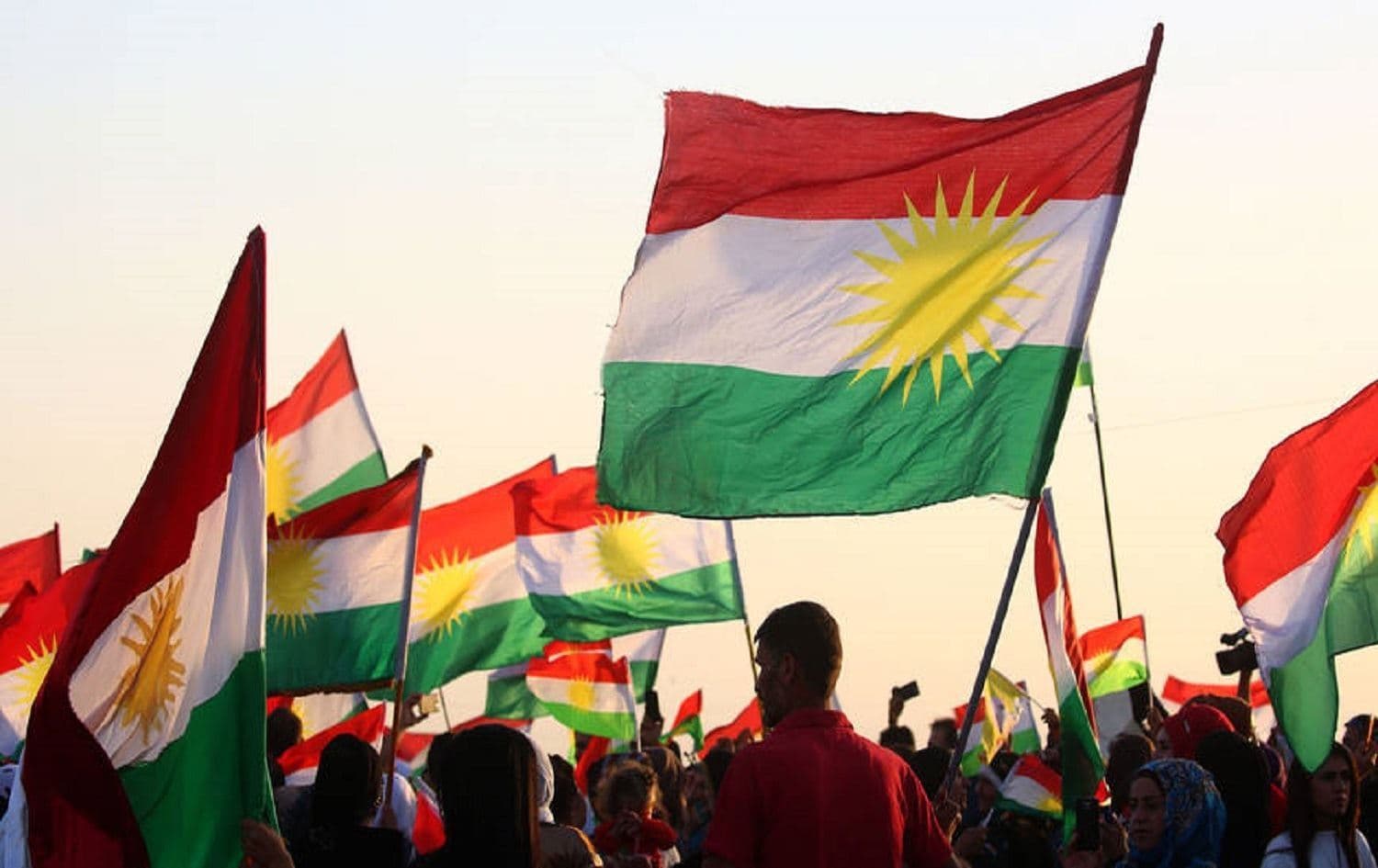 Syrian Kurds wave the Kurdish flag in Qamishli on September 27, 2017. File photo: AFP