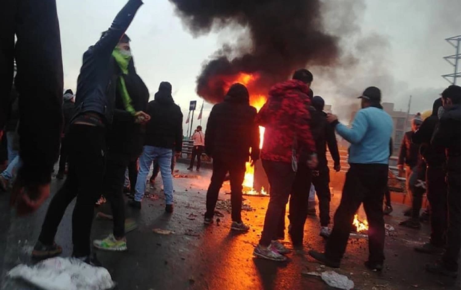 Protesters gather around a fire during a November 2019 demonstration in the Iranian capital of Tehran. Photo: AFP