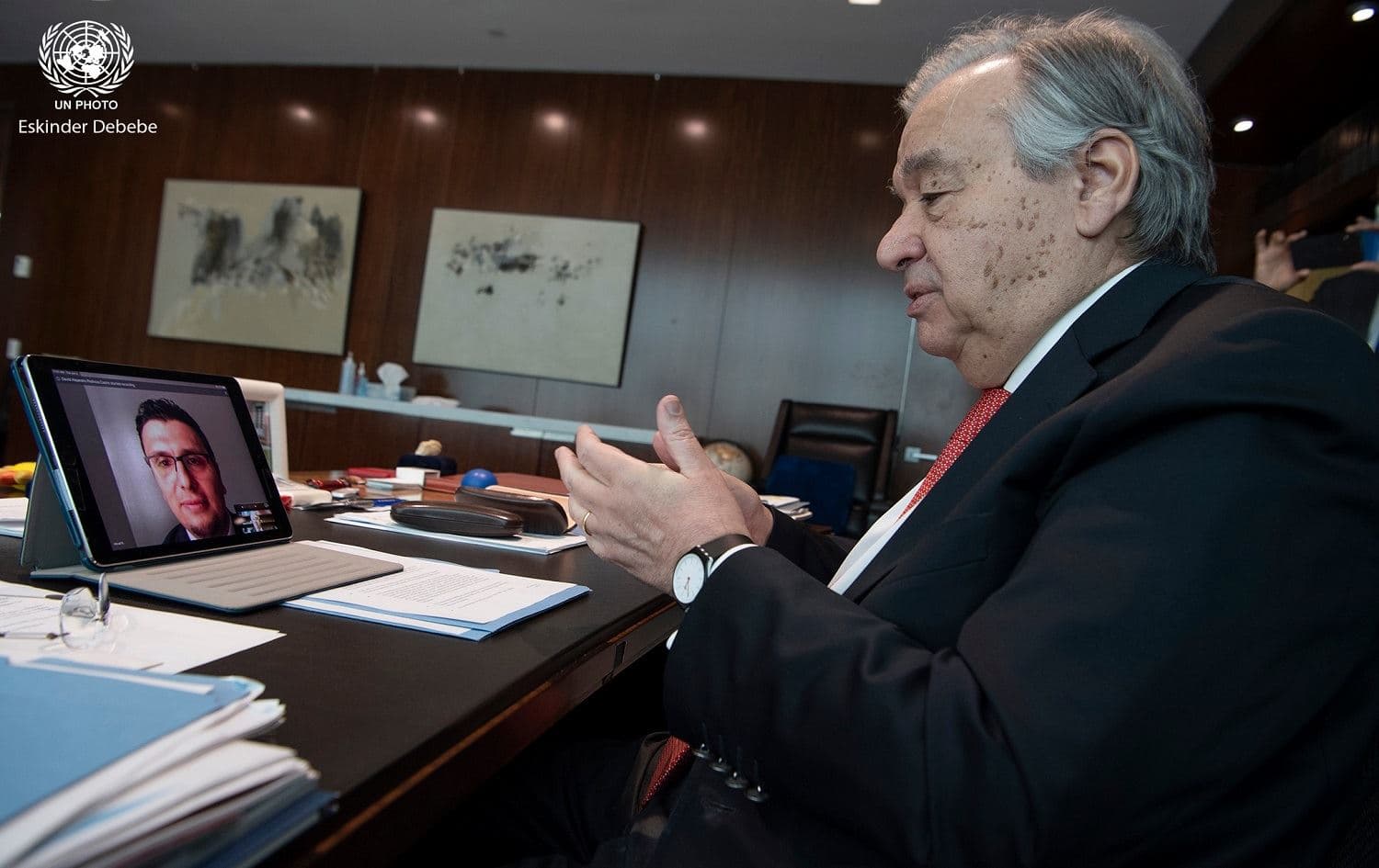 UN Secretary-General António Guterres speaking to Kurdish former refugee and doctor Heval Kelli in a video call Wednesday. Photo: Eskinder Debebe/ UN