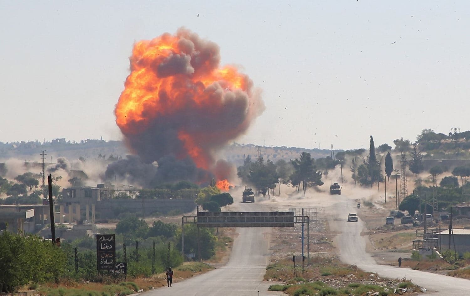 A fireball erupts from the site of an explosion reportedly targeting a joint Turkis-Russian patrol near Ariha on July 14, 2020. Photo: Mohammed AL-RIFAI/ AFP
