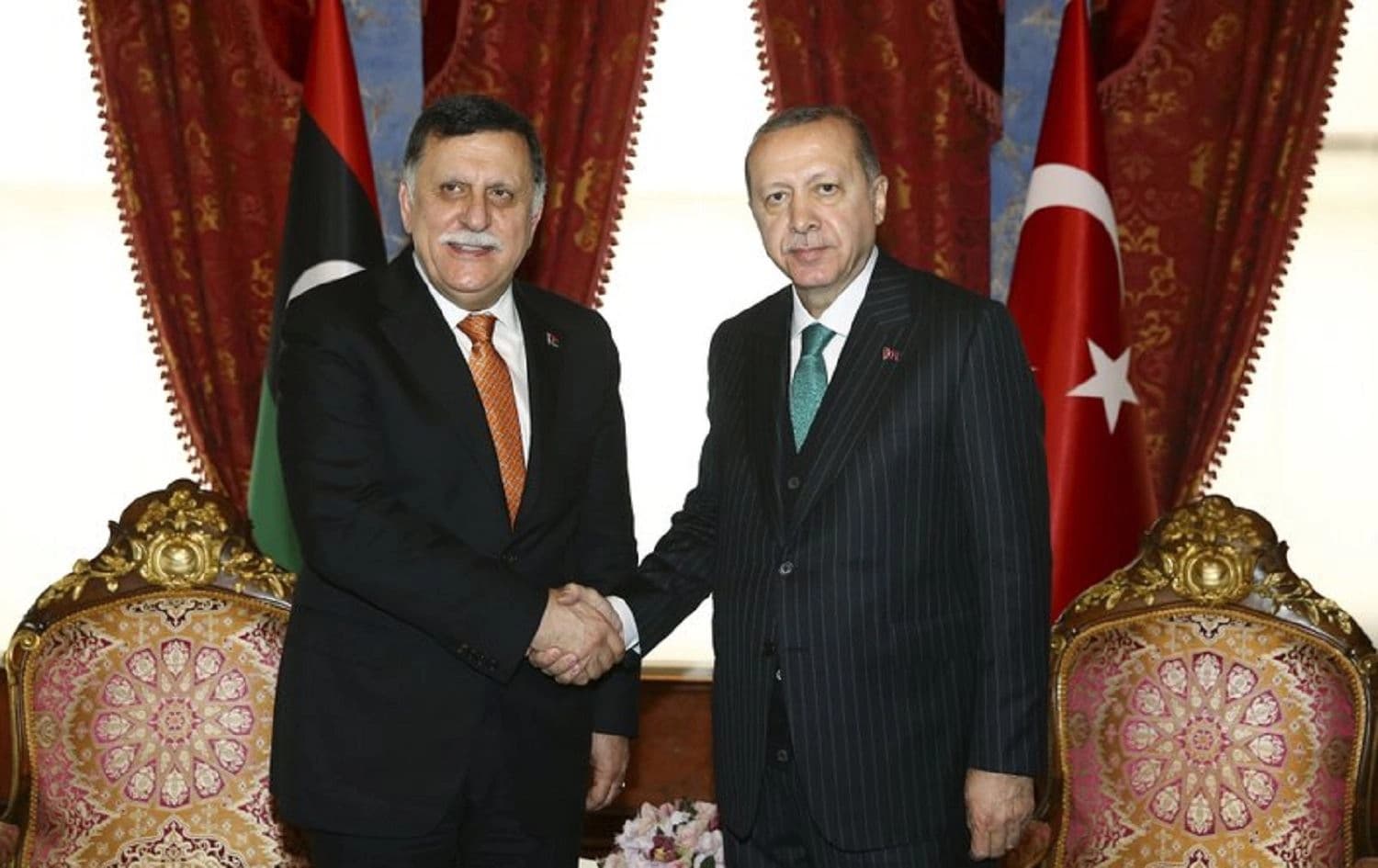 Turkish President Recep Tayyip Erdogan (right) shakes hands with Fayez al-Sarraj, the Chairman of the Libyan Presidential Council in Istanbul on February 26, 2018. File photo: Kayhan Ozer / AP