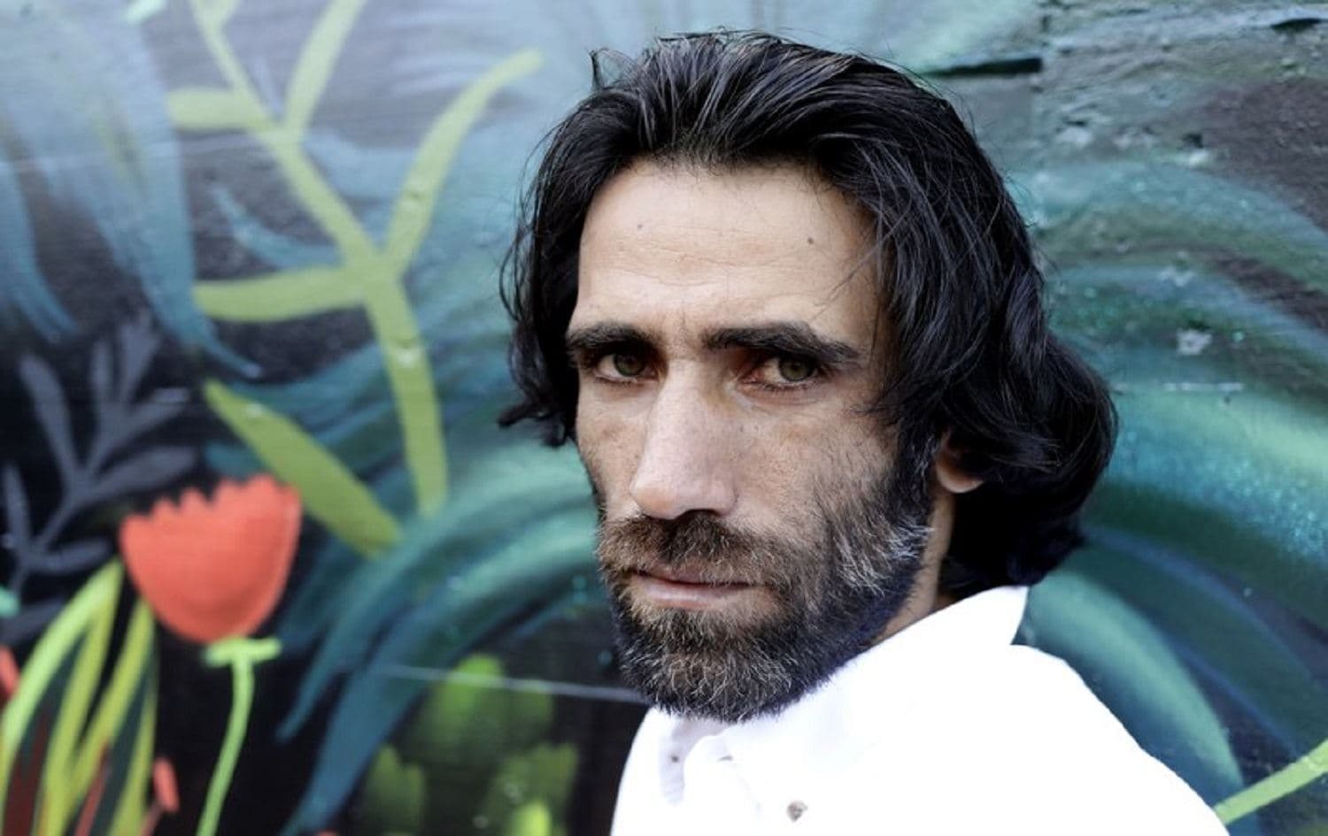In this Nov. 19, 2019, file photo, Behrouz Boochani, the Kurdish film-maker, writer and refugee who has documented life inside the Australian offshore immigration camp on Manus Island, poses for a portrait in Christchurch, New Zealand. Photo: Mark Baker / AP