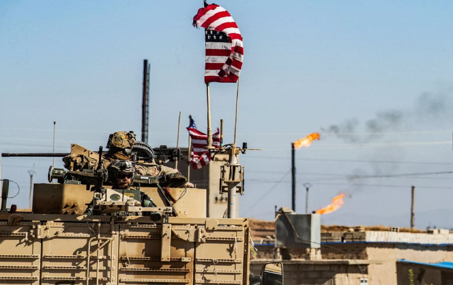 A US military vehicle drives in a patrol past an oil well in Rmelan, northeast Syria on November 6, 2019. Photo: Delil Souleiman/AFP