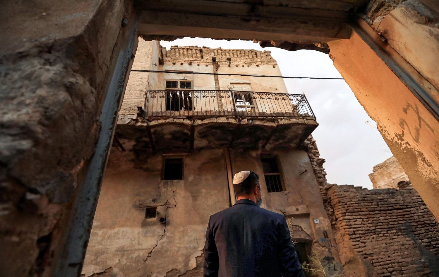 Ranj Abderrahman Cohen, an Iraqi Kurdish Jewish man, stands at a ruined Jewish synagogue in Erbil on July 5, 2020. Photo: Safin Hamed/AFP
