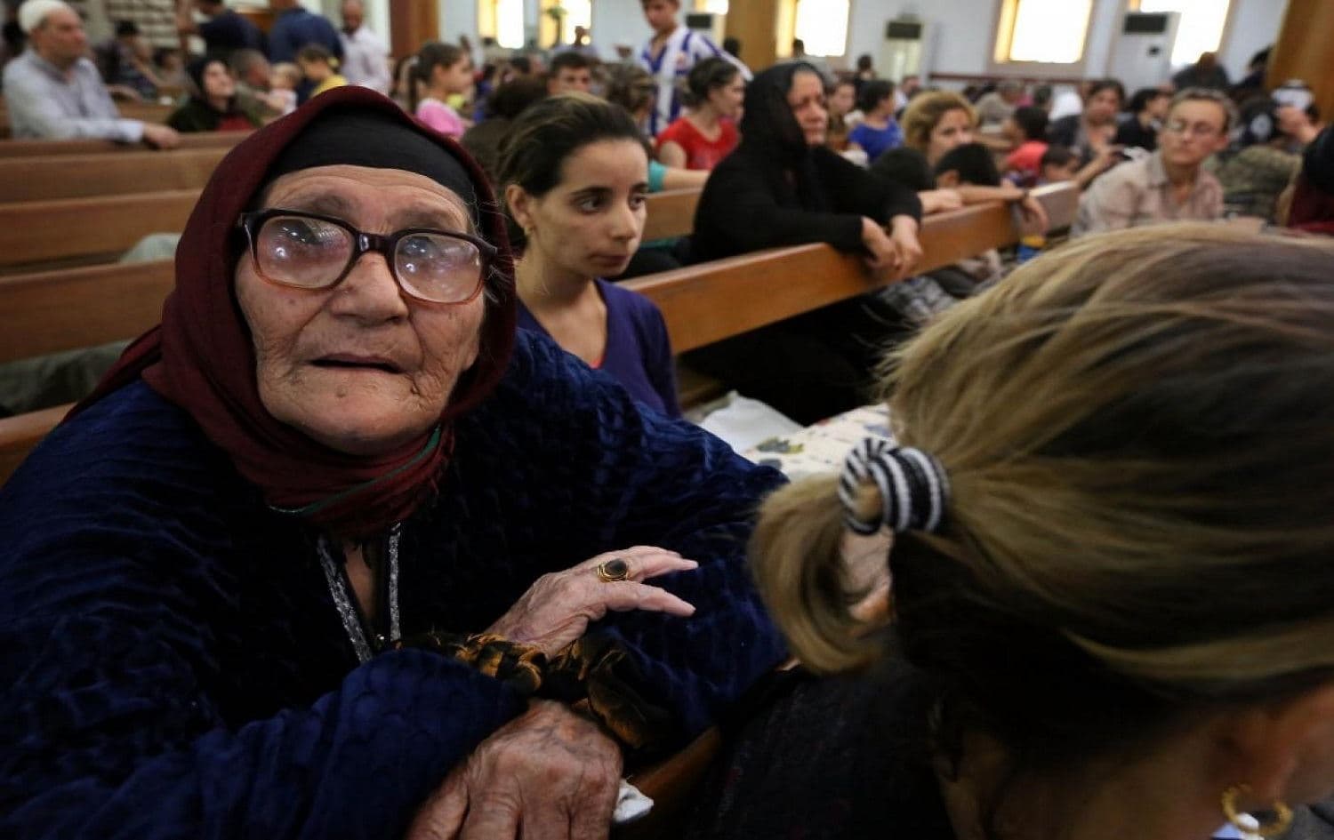 Iraqi Christians who fled the violence in the village of Qaraqush, arrive in the city of Erbil on August 7, 2014. Photo: AFP
