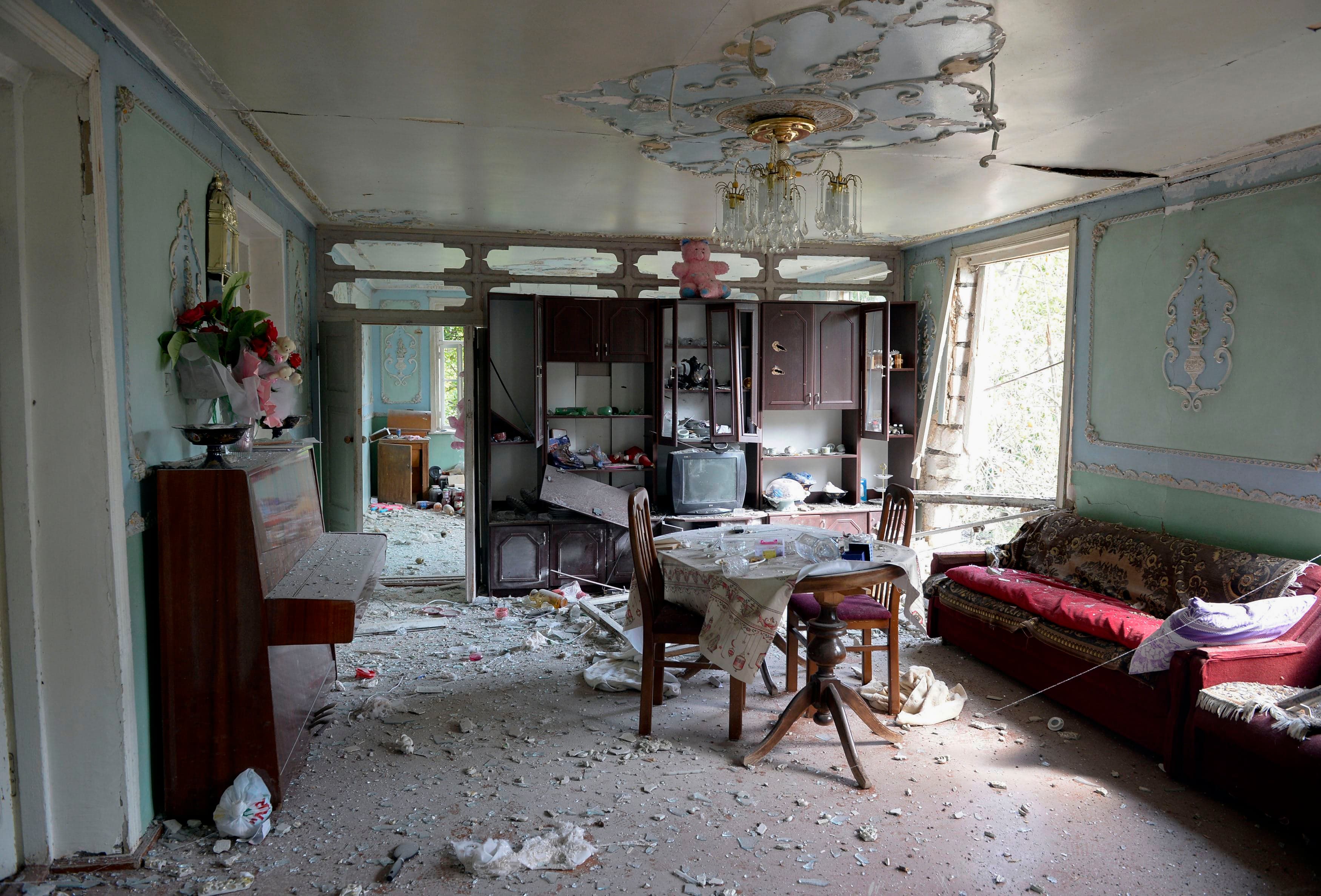 An interior view of a house which is said was damaged in recent shelling during clashes between Armenian separatists and Azerbaijan over the breakaway Nagorny Karabakh region, in the village of Sahlabad outside the Azerbaijani city of Tartar on September 29, 2020. Photo: Tofik Babayev / AFP