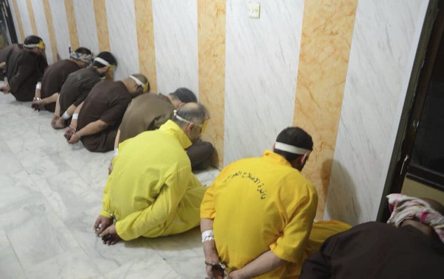 Blindfolded prisoners ahead of their execution in Iraq. June 29, 2018. Photo: Iraq Ministry of Justice via AP