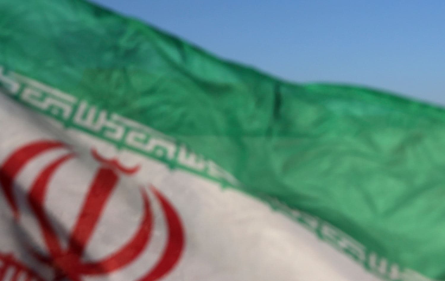 A national flag flies in front of an Iranian radar system system in an unidentified location in Iran on October 21, 2020. Photo: Iranian Army office / AFP
