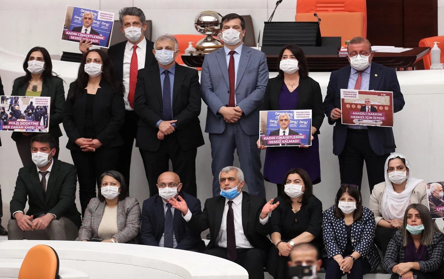 Omer Faruk Gergerlioglu and his colleagues pose after the parliament stripped his parliamentary seat in Ankara, on March 17, 2021. Photo: Adem Altan/AFP