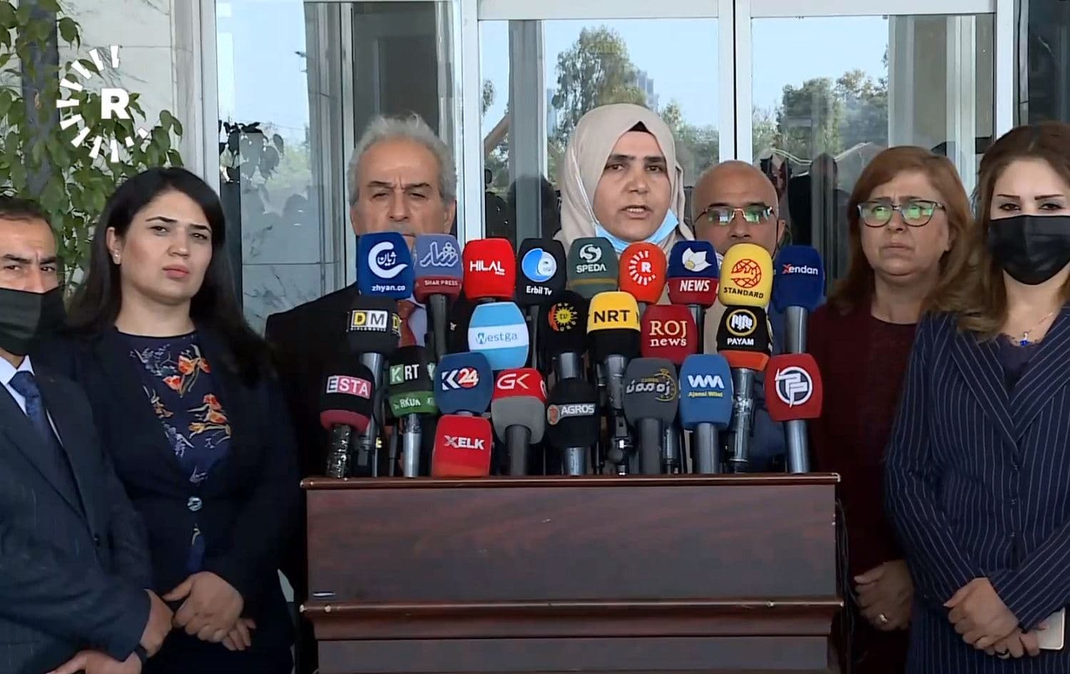 Badriya Sewaily, rapporteur from parliament’s Social Affairs and Protection of Human Rights Committee, surrounded by members of the committee, speaks during a press conference in Erbil on April 1, 2021. Photo: Rudaw