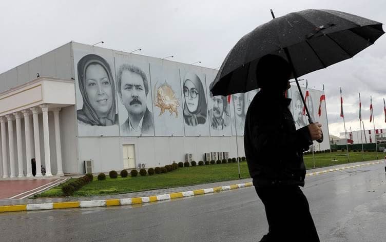 A member of Mujahedin-e Khalq walks in a street at the Ashraf-3 camp, which is a base for the People's Mojahedin Organization of Iran (MEK) in Manza, March 4, 2020. Photo: Gent Shkullaku/ AFP