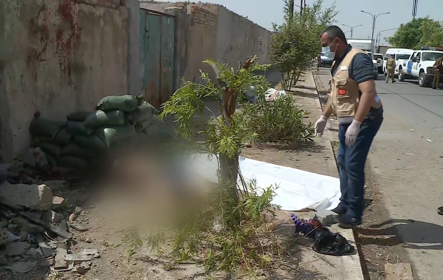 A man inspects the aftermath of an explosion at the entrance of Kirkuk's national security directorate building on April 29, 2021. Photo: screengrab from Rudaw video
