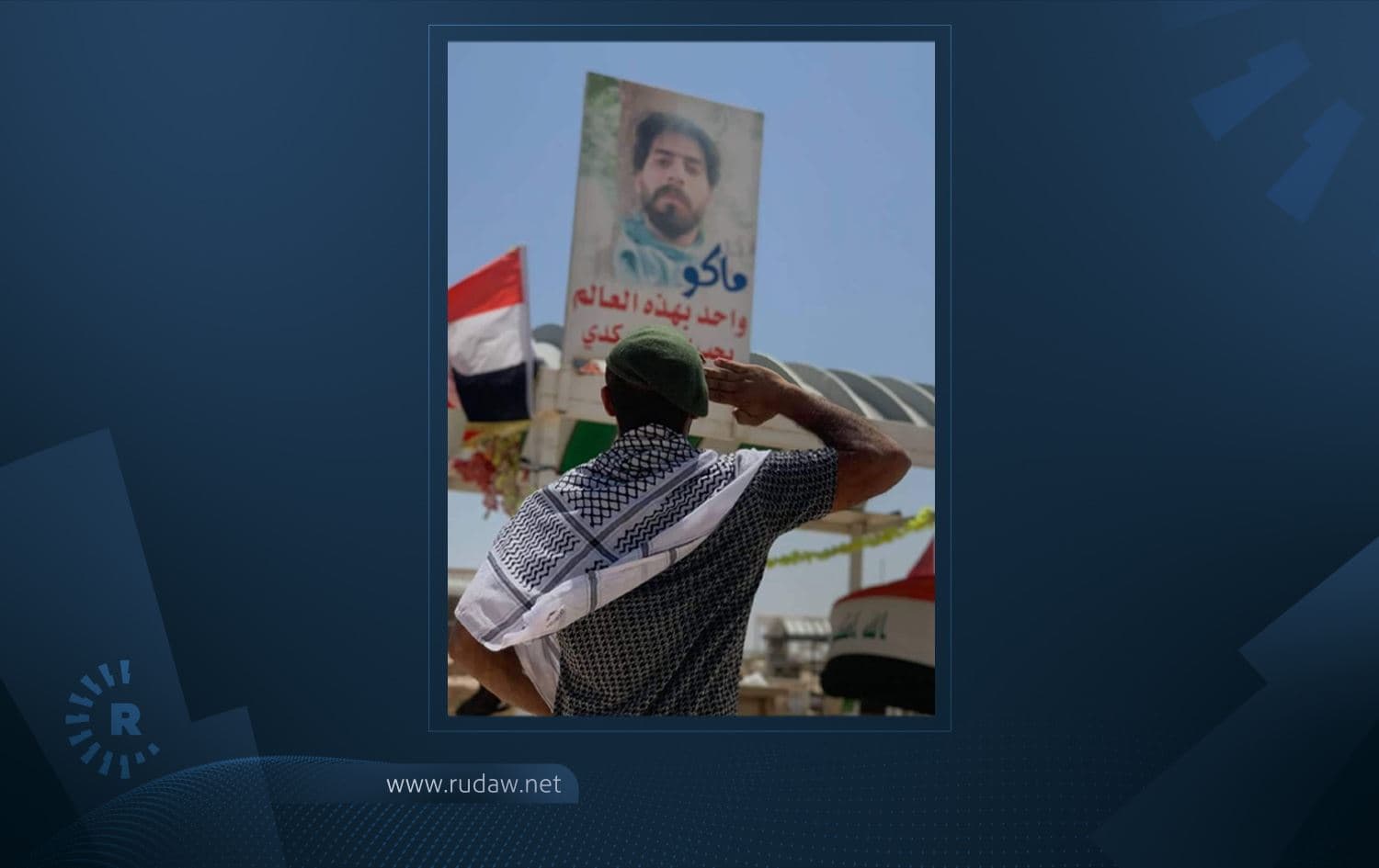 A protester salutes at the graveside of slain Iraqi activist Safaa al-Sarai in Najaf on May 14, 2021. Photo: submitted to Rudaw