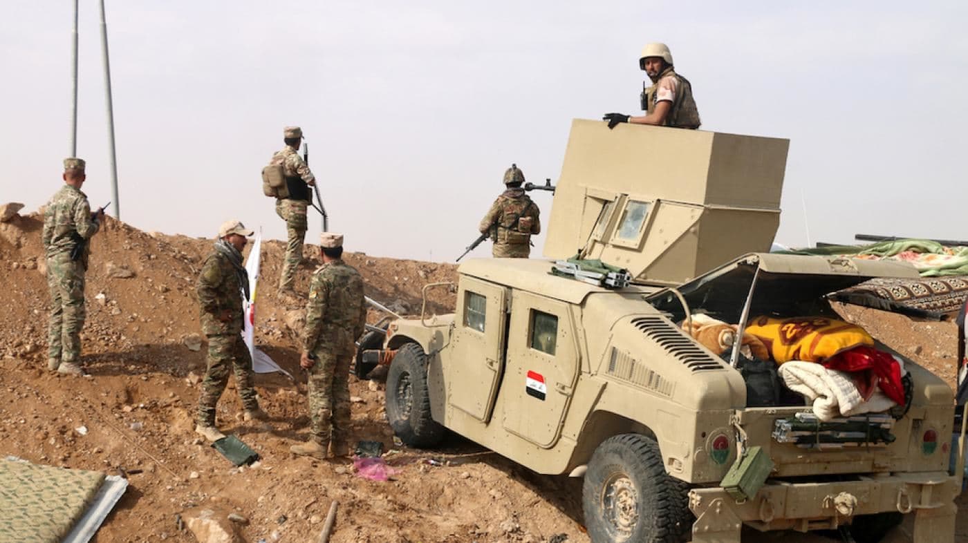 Iraqi forces stand guard near the Iraq-Syria border. File photo: AFP