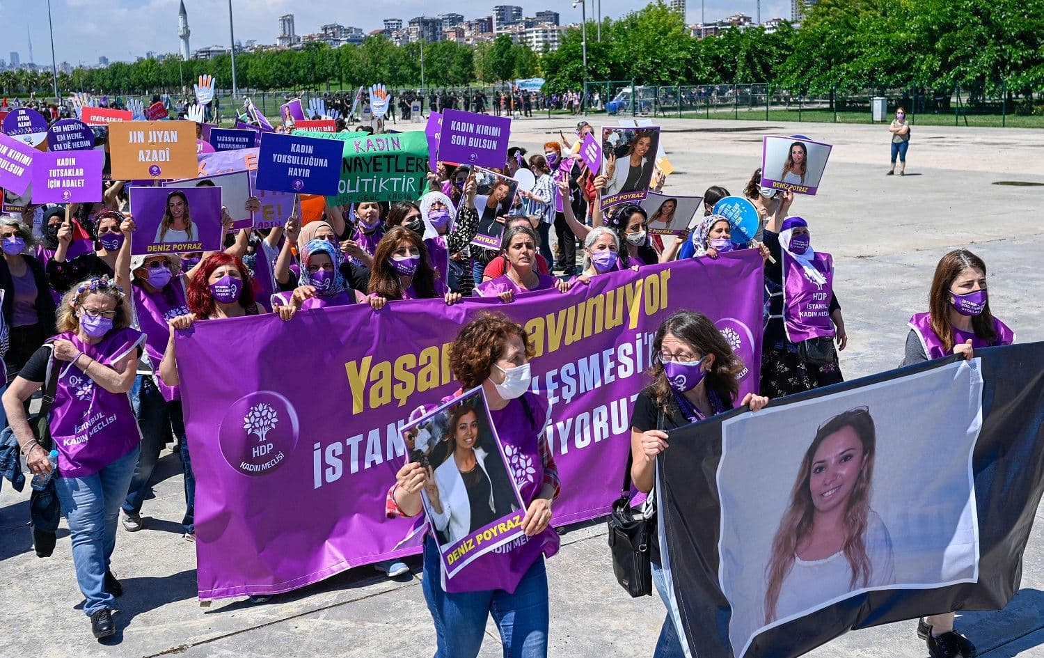 Women hold a banner with the picture of Deniz Poyraz, killed in an attack at HDP's Izmir headquarters, during a rally against Turkey's withdrawal from Istanbul Convention in Istanbul, on June 19, 2021. Photo: Bulent Kilic/AFP