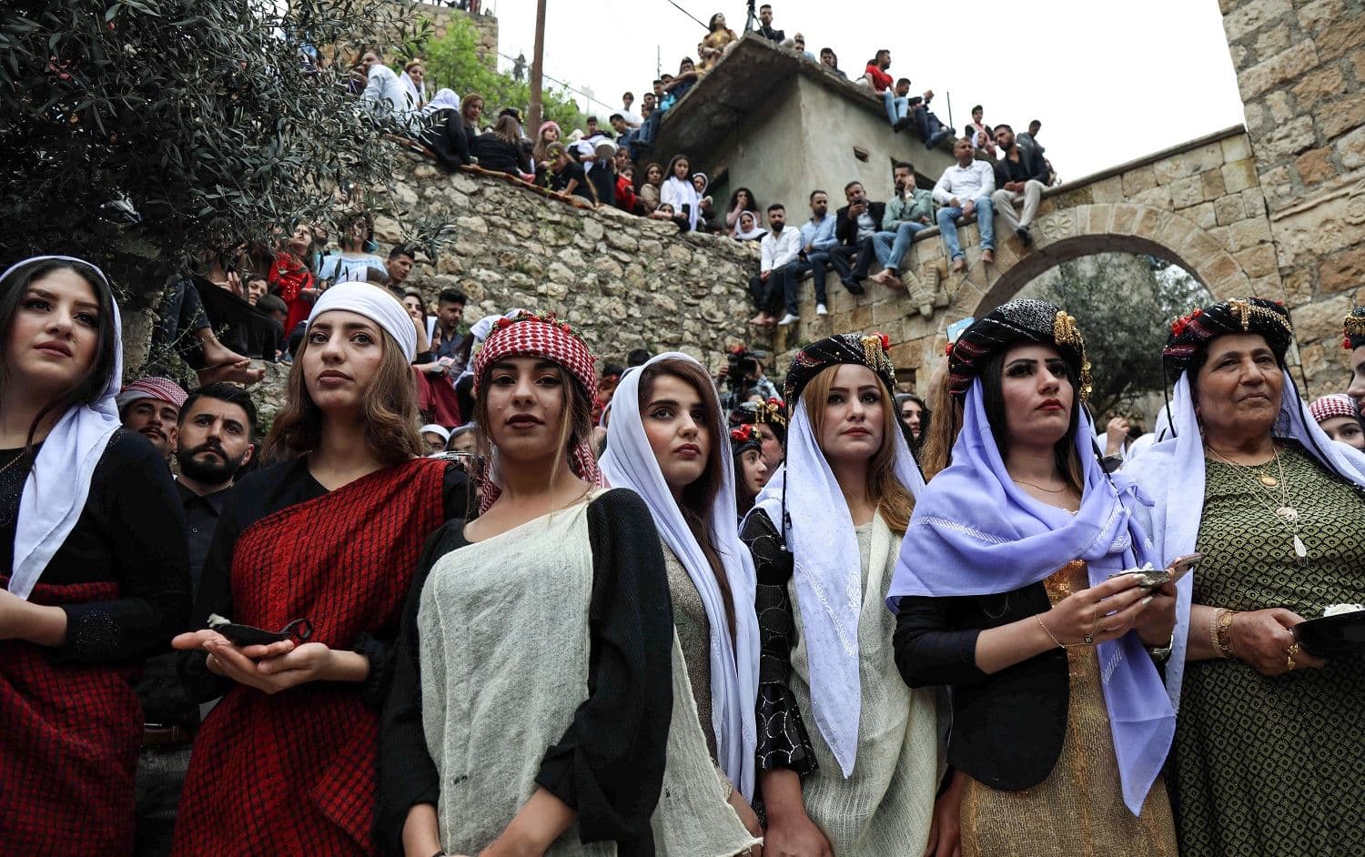 Yezidi women gather outside the ancient Temple of Lalish during a ceremony marking the Yezidi New Year. Photo: AFP/Safin Hamed