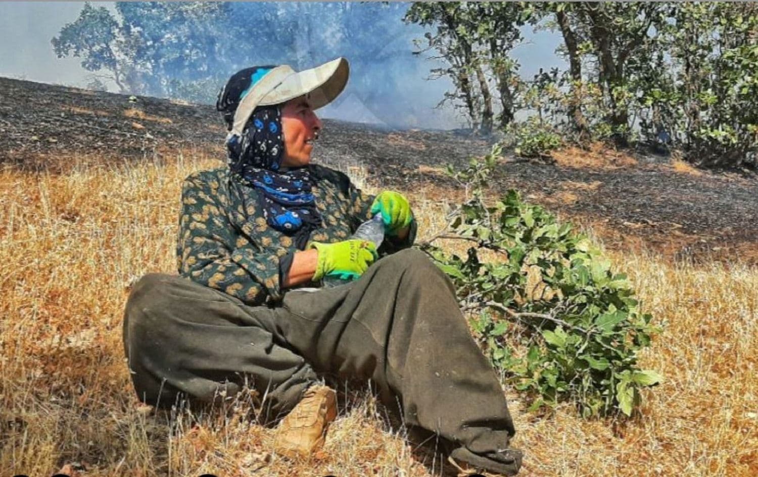 Chya Sabz volunteer Amin Studa takes a break from battling forest fires in Mariwan. Photo: submitted
