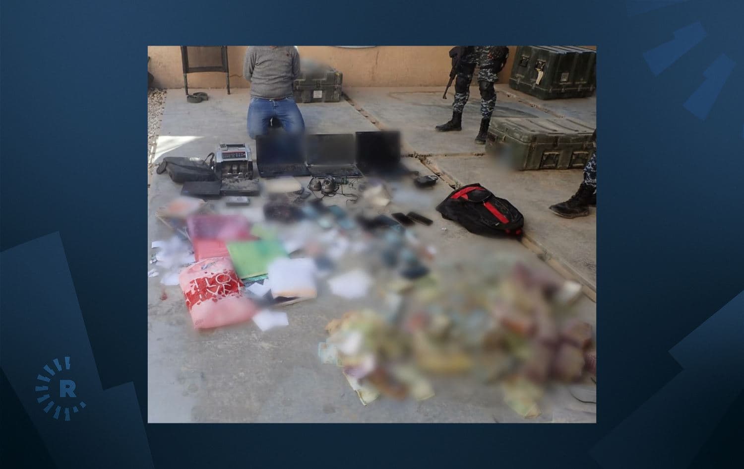 Kurdish forces display items seized during the arrest of an ISIS financier in Deir ez-Zor in a photo released on November 24, 2021. Photo: handout/SDF