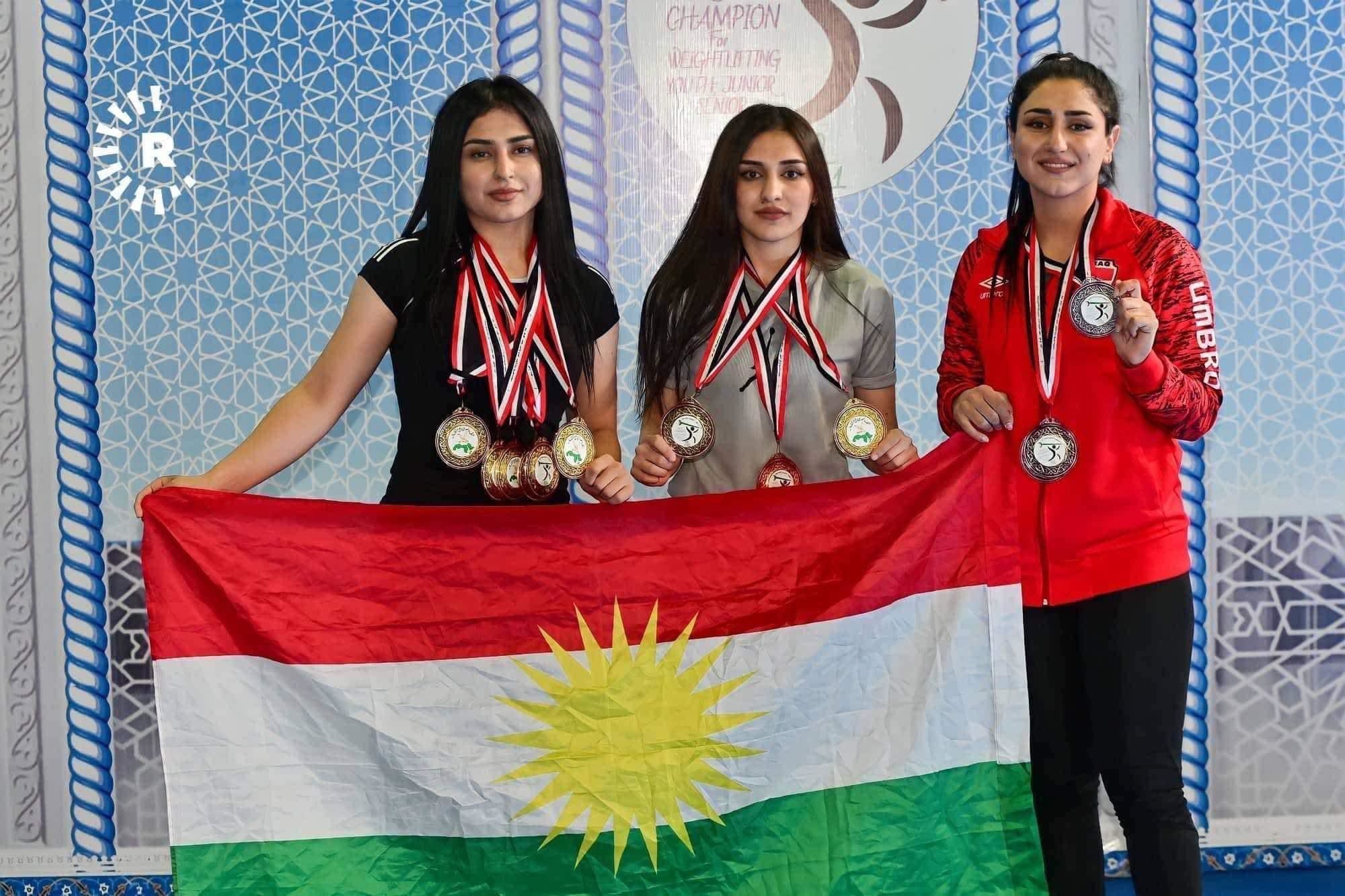 The three Kurdish sisters, Oshin Muhsin (right), Israa Muhsin (middle), and Inas Muhsin (left) won 12 medals at an international weightlifting competition held in the Kurdistan Region in December. Photo: Bilind T. Abdullah/Rudaw