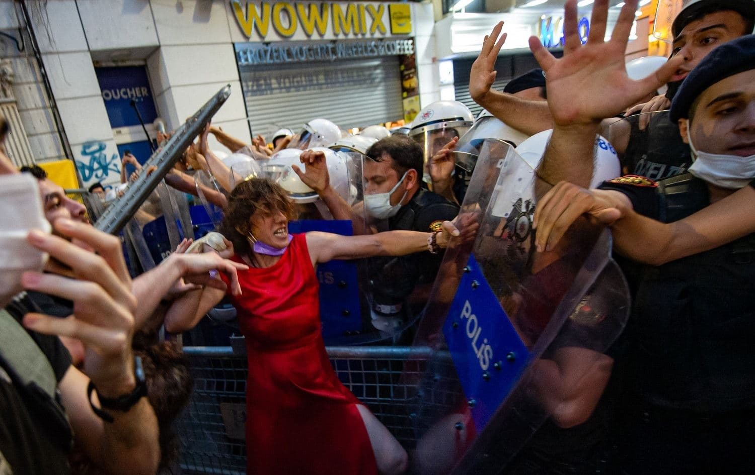 Women demonstrators clash with Turkish police as they protest against Turkey's decision to withdraw from the Istanbul Convention, in Istanbul on July 1, 2021. Photo: Yasin Akgul/AFP