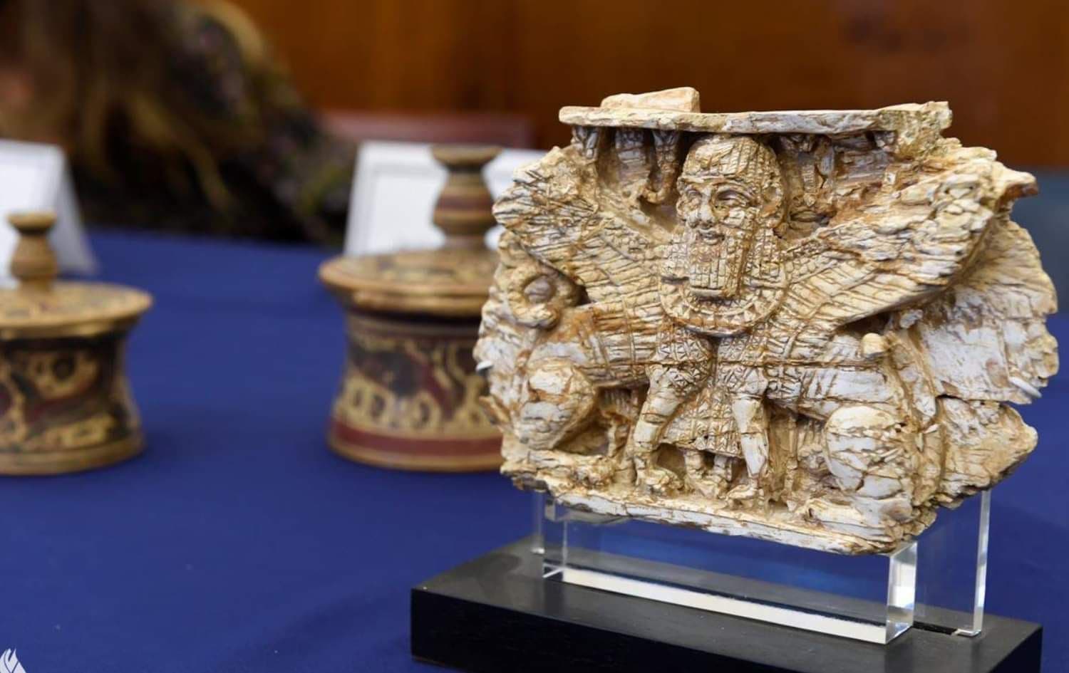 An ivory plaque dating from (701-800 BC), depicting a winged human-headed Sphinx that was used to decorate royal furniture returned to the Iraqi embassy in the US on January 22, 2022. Photo: Iraqi Foreign Ministry website