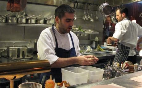 Amedi at work in the kitchen of his London restaurant. Photo by author.