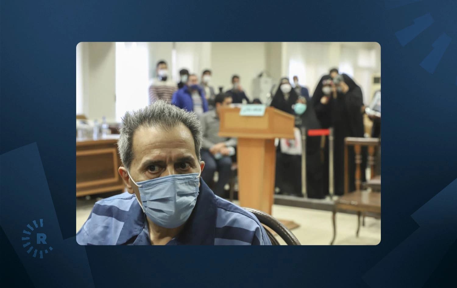 Iranian-German national and U.S. resident Jamshid Sharmahd, the alleged leader of the militant wing of a U.S.-based Iranian opposition group who is accused of planning a 2008 bombing at a mosque that killed 14 people and wounded over 200 in Iran, attends his trial at the Revolutionary Court, in Tehran, Iran, Sunday, Feb. 6, 2022. Photo: Koosha Mahshid Falahi/Mizan News Agency via AP