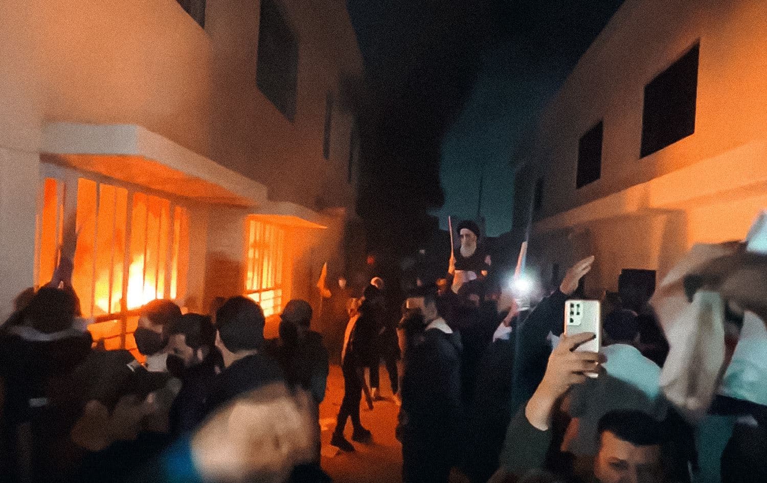 Supporters of pro-Iran parties and militia groups attack KDP's office in Baghdad on March 28, 2022. Photo: Sabreen News/Telegram