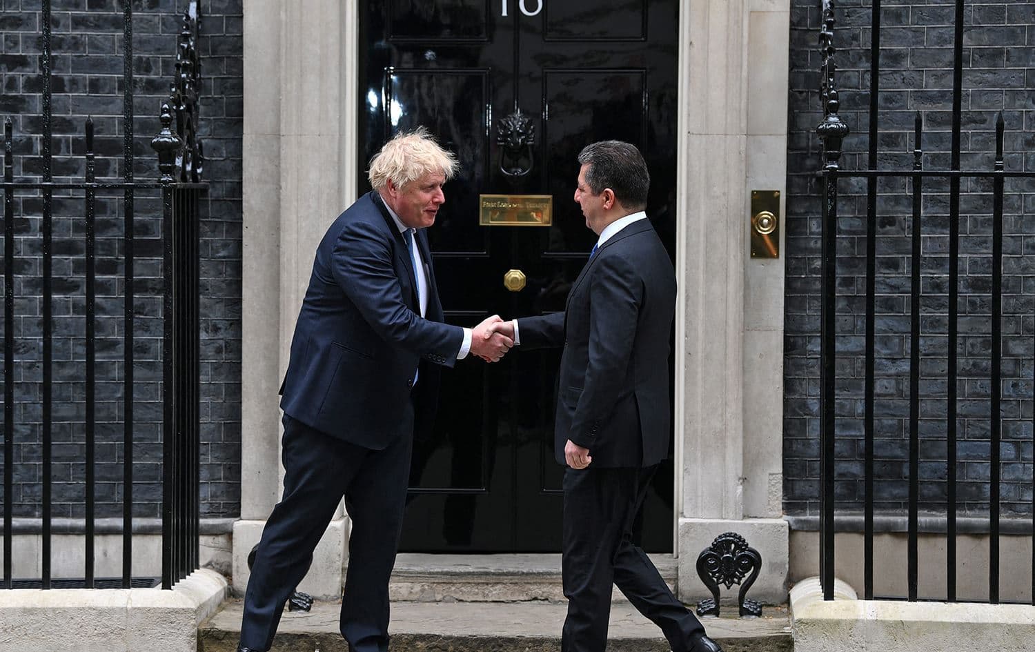 UK Prime Minister Boris Johnson shakes hands with Kurdistan Region Prime Minister Masrour Barzani outside 10 Downing Street in London on April 19, 2022, ahead of their meeting. Photo: Daniel Leal/AFP
