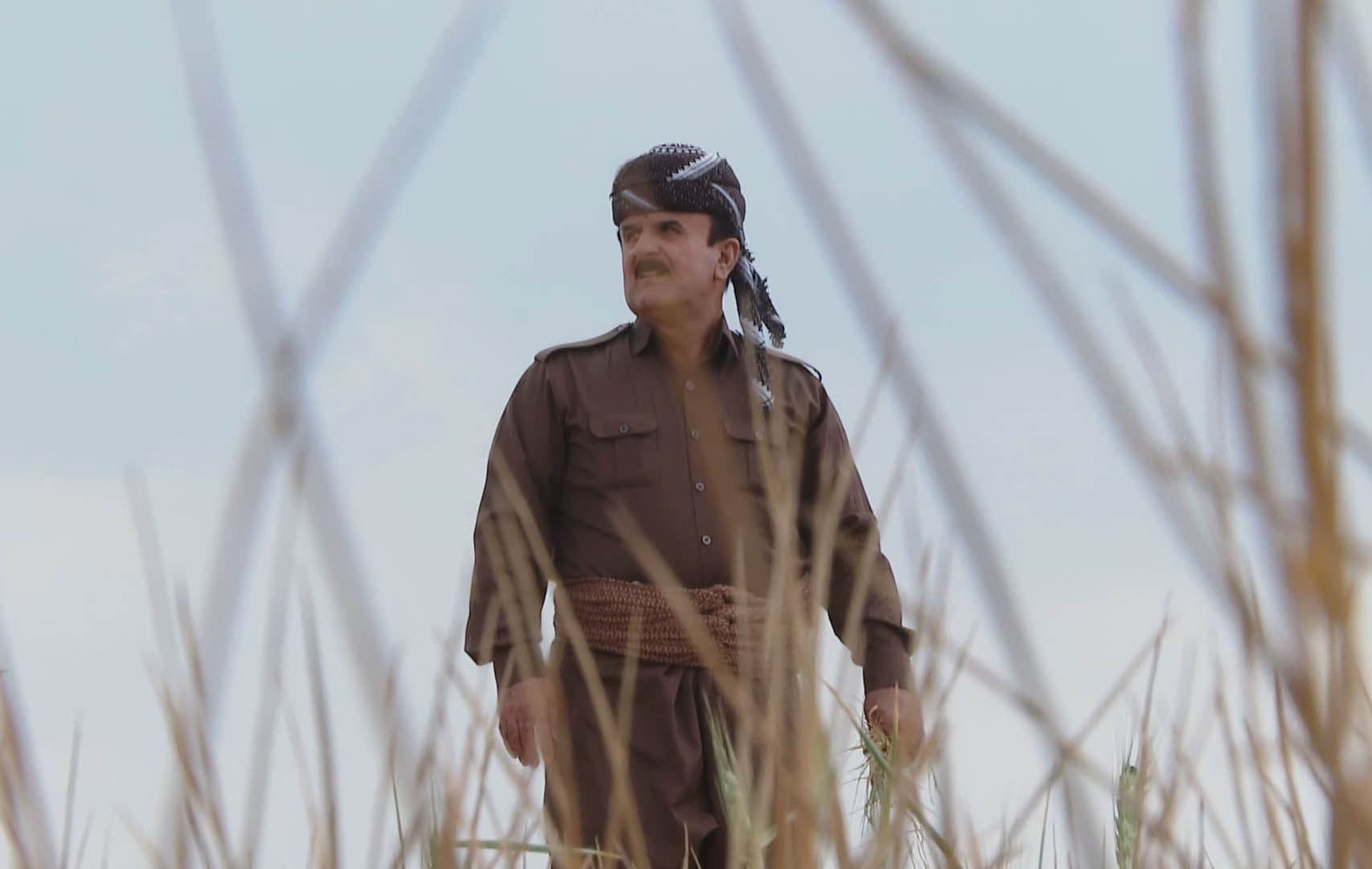 Abdullah Hamad, 55, walking in his farmland in the Kurdistan Region's Duhok province on April 27, 2022. Photo: Rudaw