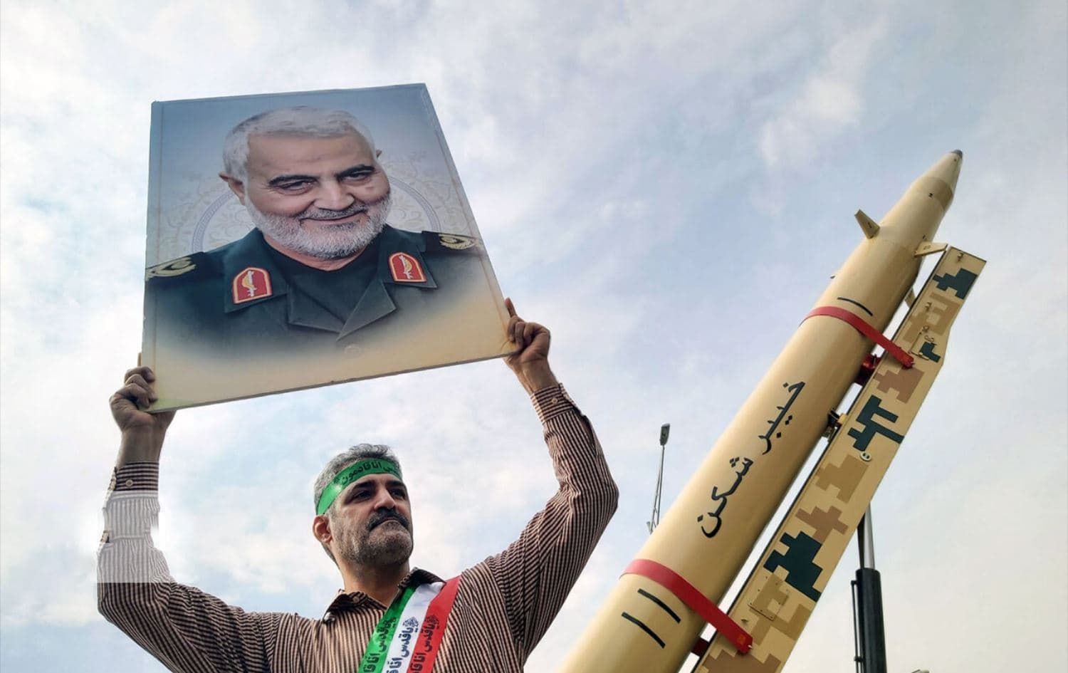 A civilian carries photo of Iranian general Qasem Soleimani during Quds Day rallies in Tehran on April 29, 2022. Photo: Iranian state media