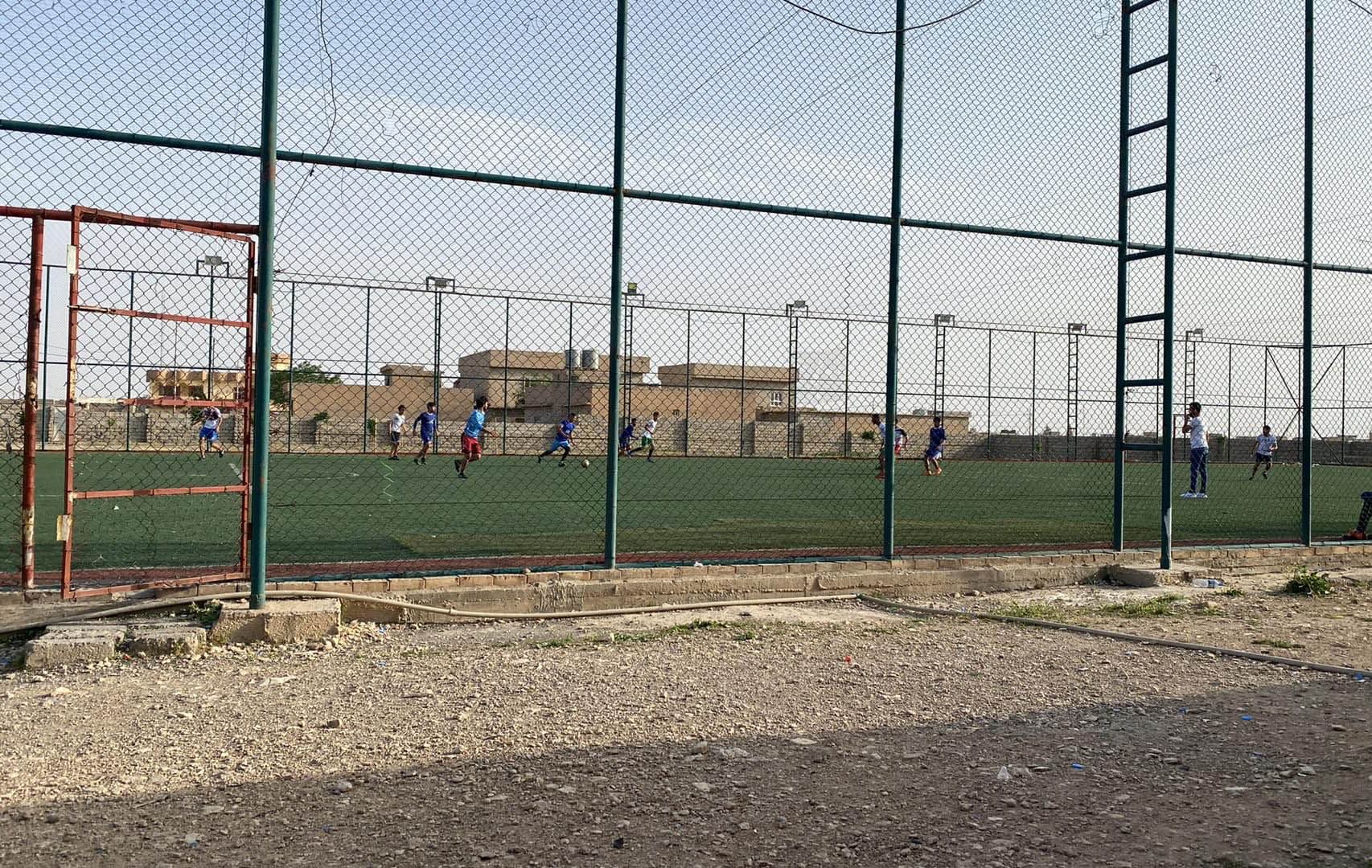 Young people play in Basateen football stadium, located in Shingal’s Pir Zaker neighborhood, on May 3, 2022. Photo: Farhad Barakat/Submitted