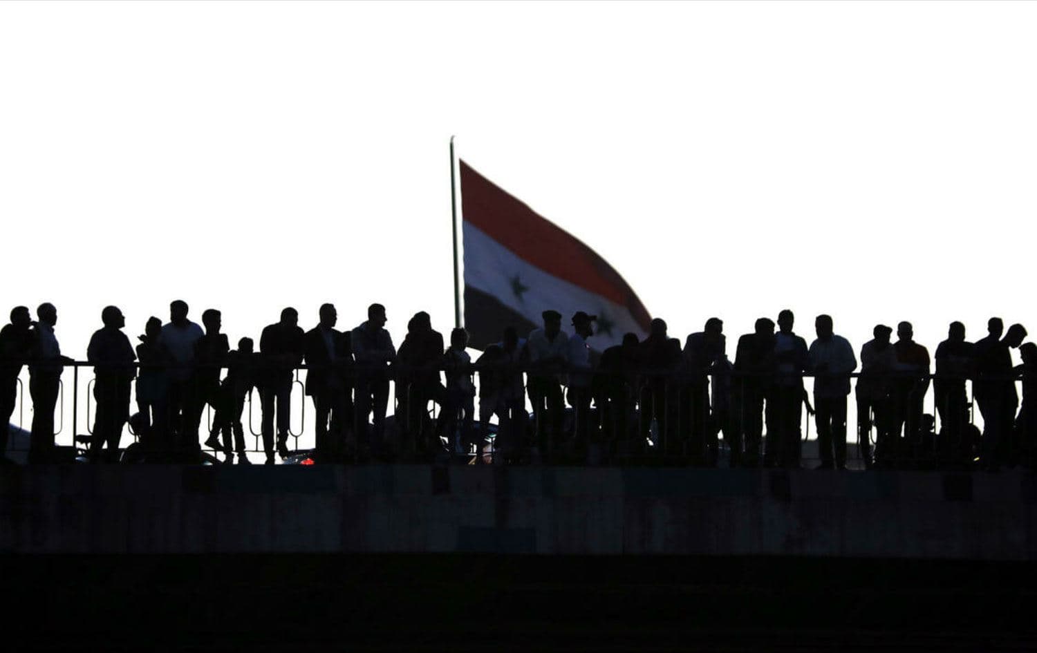 Syrians await the release of jailed relatives after a general amnesty was issued. Photo: AFP