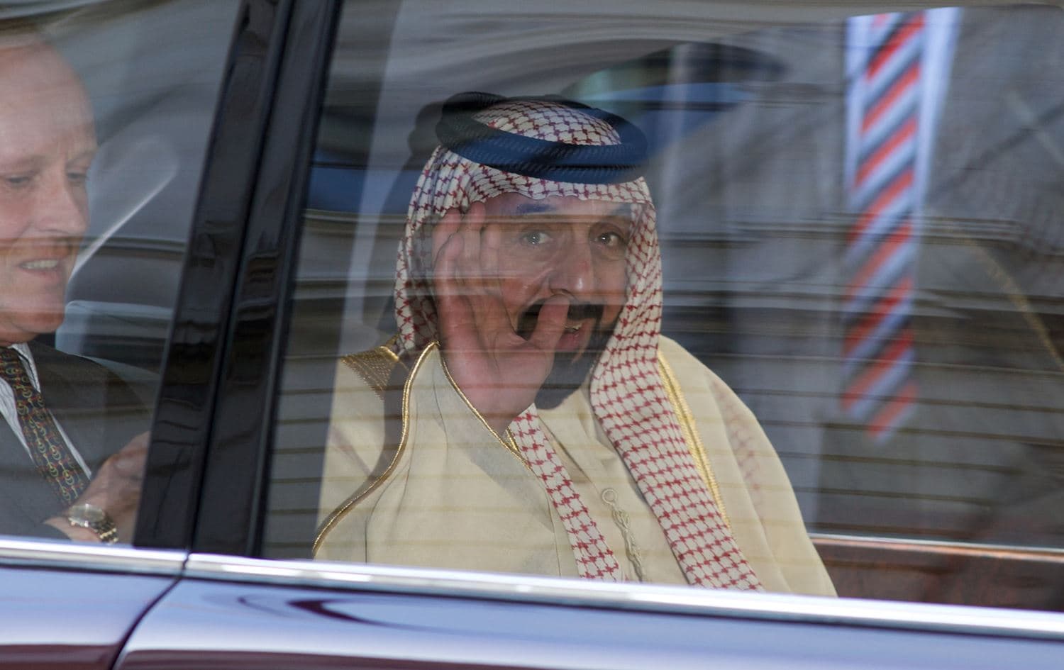 Sheikh Khalifa bin Zayed al-Nahayan waves from his vehicle as he leaves 10 Downing Street in Central London on May 1, 2013. Photo: Andrew Cowie/AFP