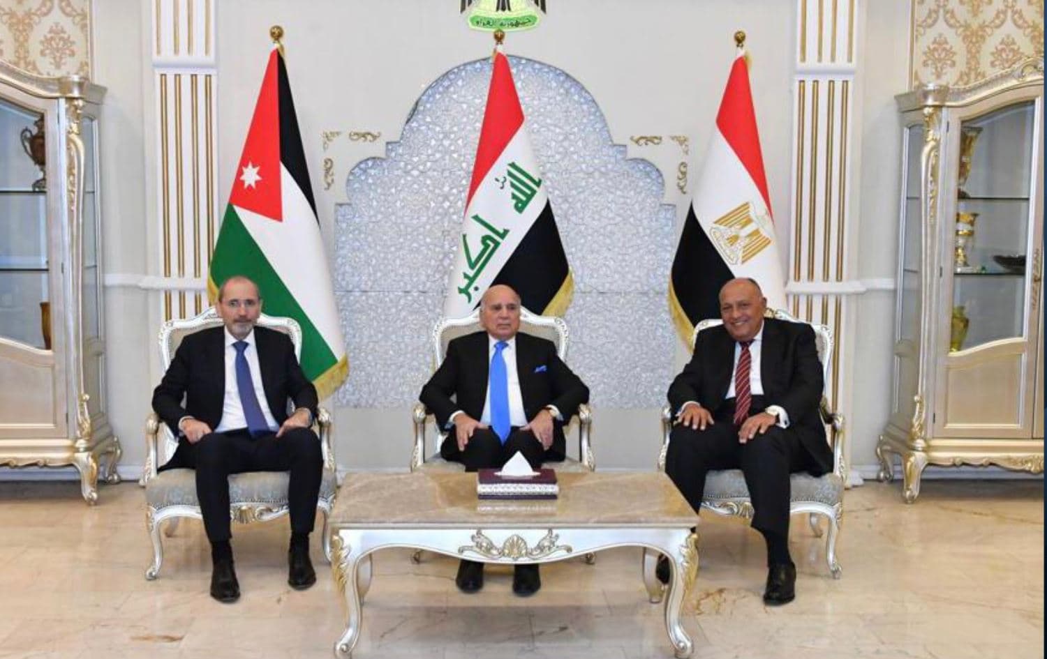 Jordanian Foreign Minister Ayman Safadi (right), Iraqi Foreign Minister Fuad Hussein (center), and Egyptian Foreign Minister Sameh Shoukry met in Baghdad on June 6, 2022. Photo: Iraqi foreign ministry