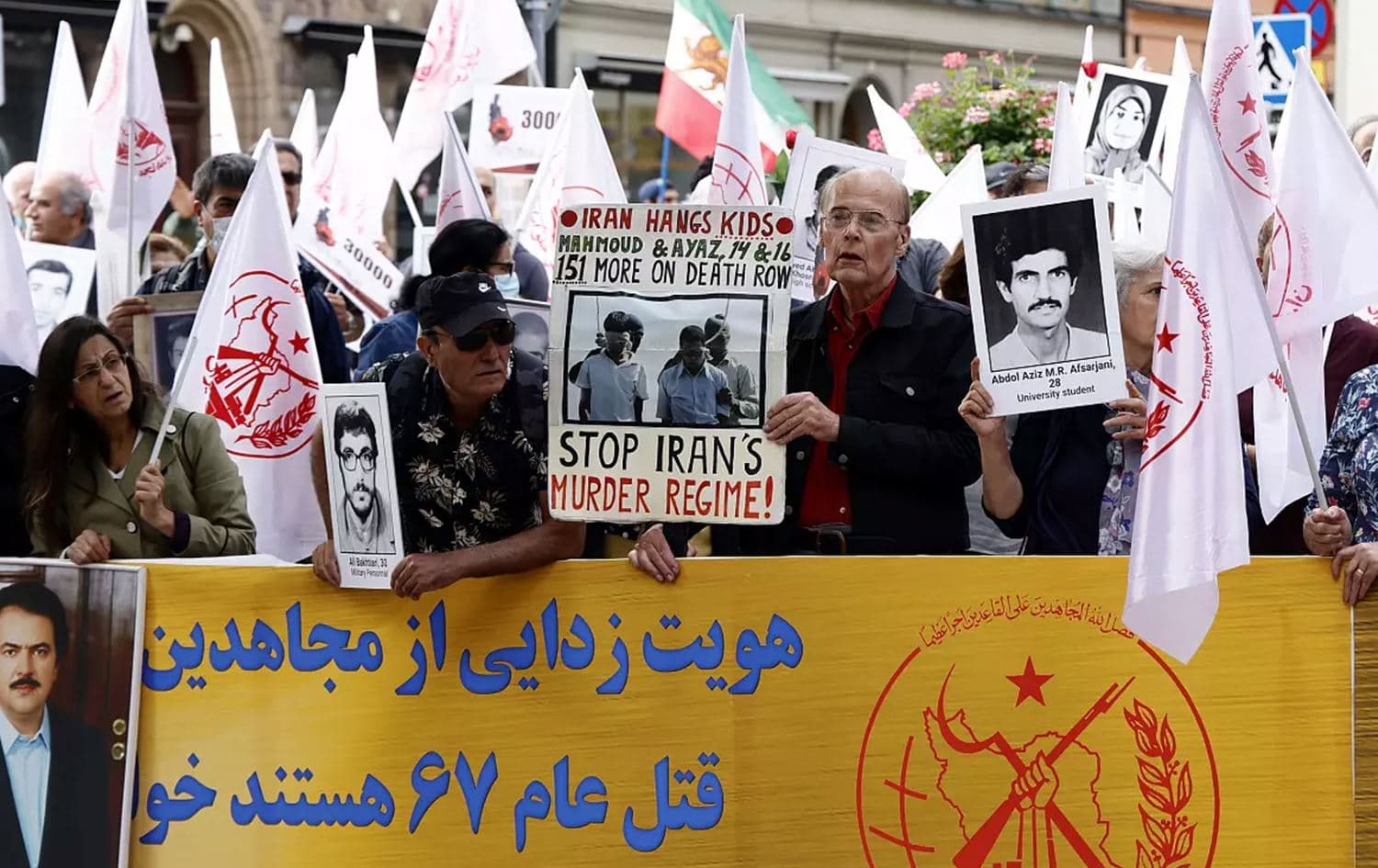 Supporters of the People's Mojahedin Organization of Iran protest outside Stockholm's district court on the first day of the trial of Hamid Nouri on Aug. 10, 2021. Photo: Stefan Jerrevang/AP