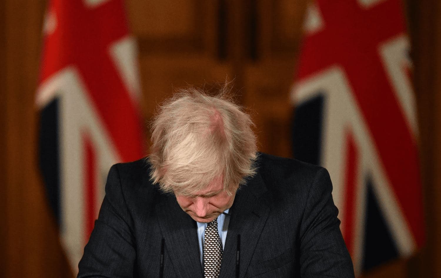In this file photo taken on January 26, 2021 Britain's Prime Minister Boris Johnson looks down at the podium as he attends a virtual press conference inside 10 Downing Street in central London. Photo: Justin Tallis/AFP