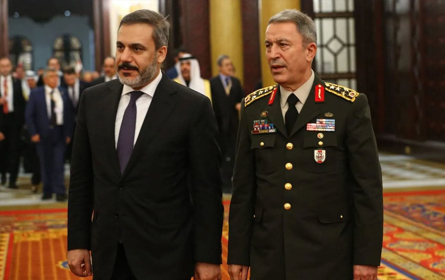 Turkish Intelligence Chief Hakan Fidan (left) and Turkish Defense Minister Hulusi Akar (right) in Bahrain on February 12, 2017. Photo: Anadolu Agency