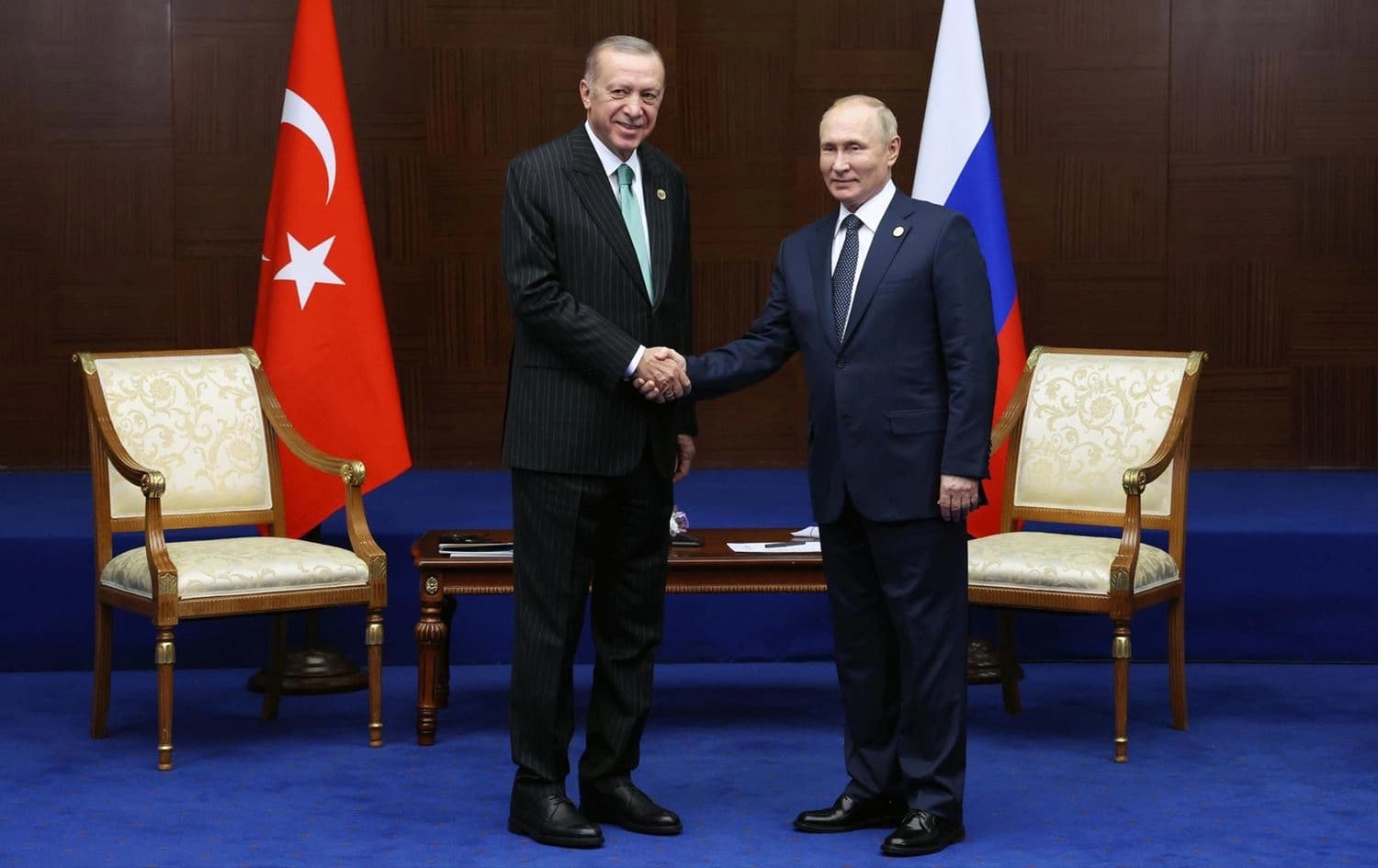 Russian President Vladimir Putin (right) and Turkey's President Recep Tayyip Erdogan (left) shake hands during their meeting on sidelines of the Conference on Interaction and Confidence Building Measures in Asia (CICA) summit, in Astana, Kazakhstan, on October 13, 2022. Photo: Vyacheslav Prokofyev/AP