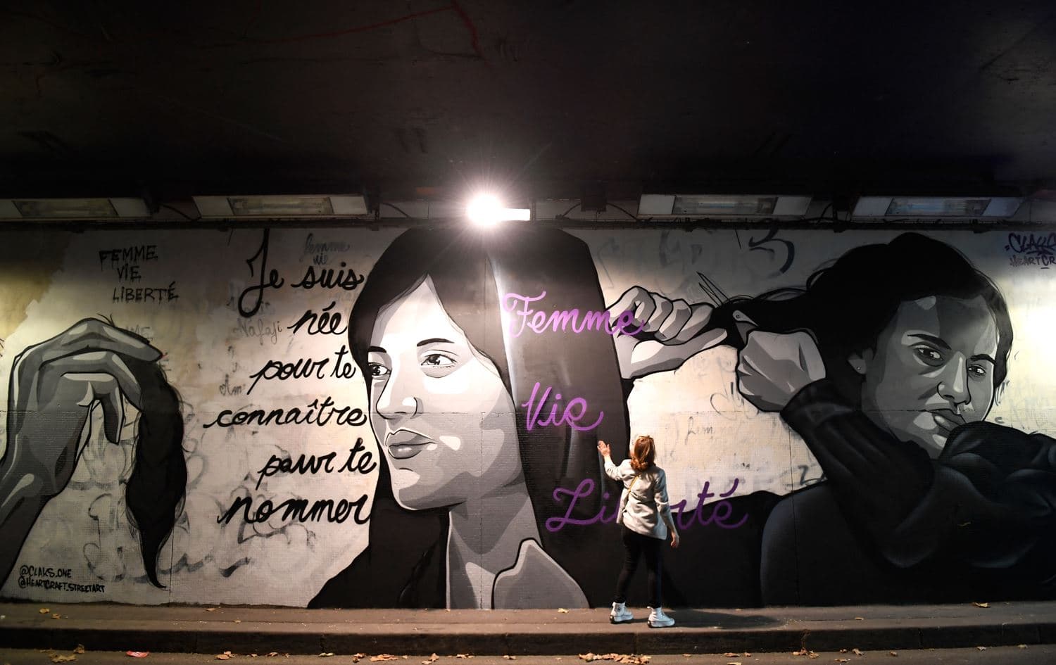 A mural in homage to Masha (Zhina) Amini by artists Claks One and HeartCraft in the Tunnel des Tuileries in Paris on October 6, 2022. Photo: Julien de Rosa/AFP
