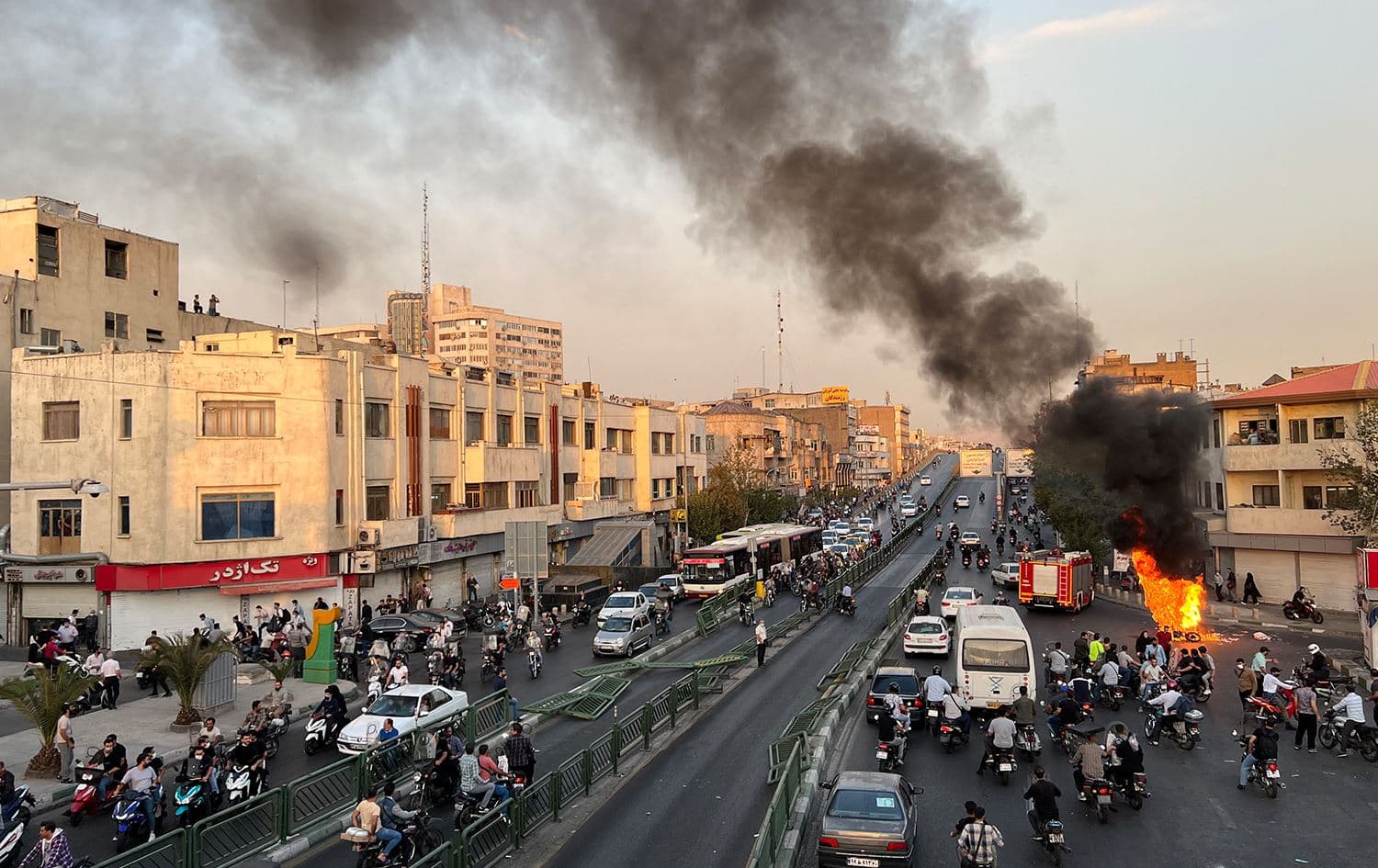 A picture obtained by AFP outside Iran, reportedly shows a motorcycle on fire in the capital Tehran, on October 8, 2022. Photo: AFP