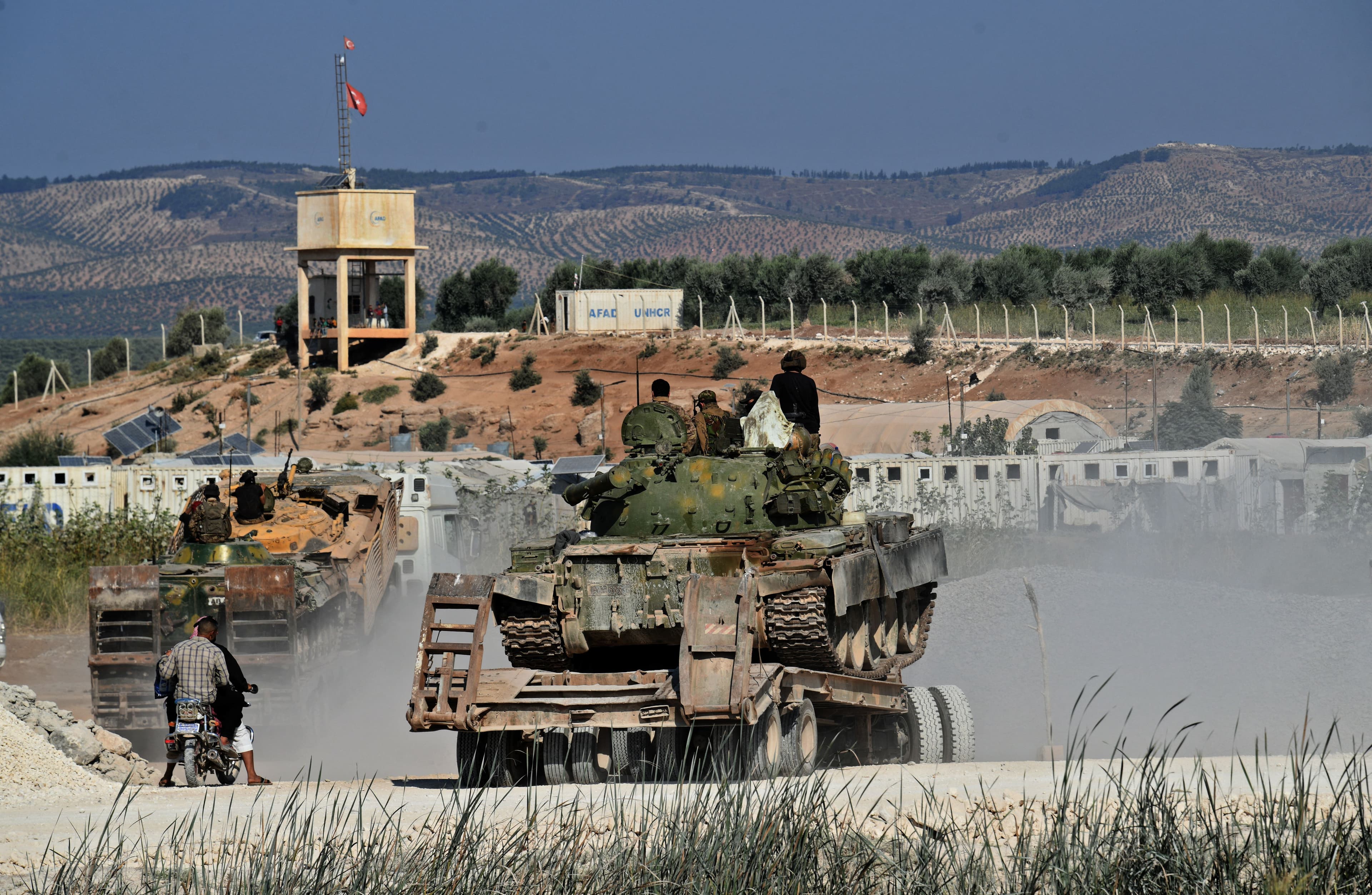 Members of the Hayat Tahrir al-Sham (HTS) jihadist group bring reinforcements on the outskirts of the Afrin region of Syria's rebel-held northern Aleppo province, on October 13, 2022. Photo: AFP