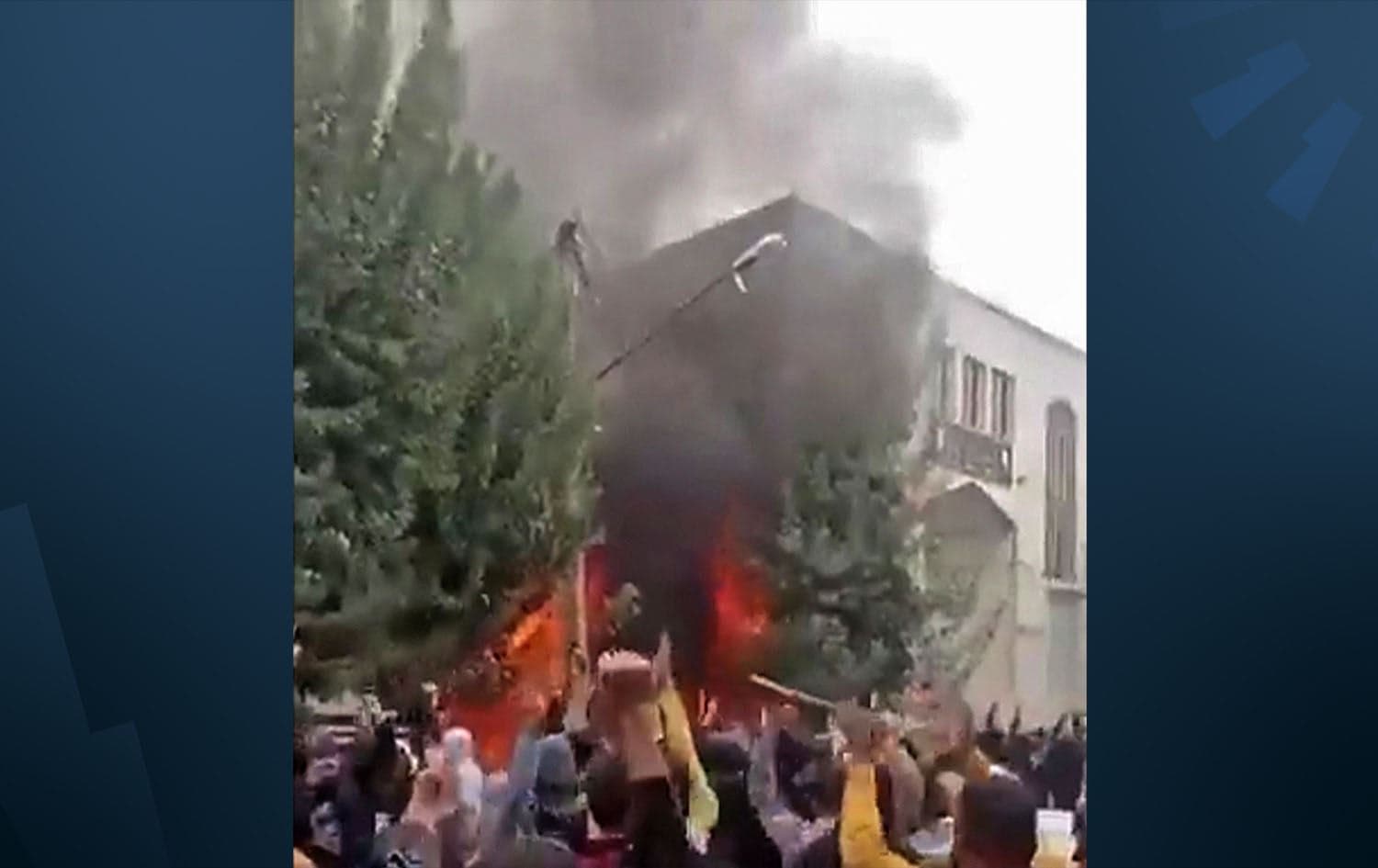 This image grab from a UGC video released on October 27, 2022, shows a fire burning at the office of the Governor of Mahabad, West Azerbaijan province of Iran.