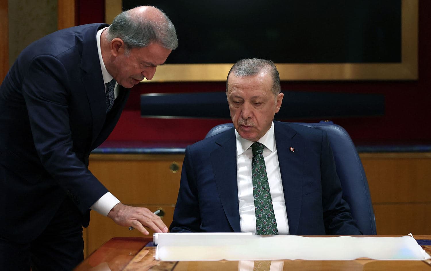 Turkey's President Recep Tayyip Erdogan speaks with National Defence Minister Hulusi Akar in an undisclosed location onboard the presidential aircraft. Photo:Turkish Presidency/AFP