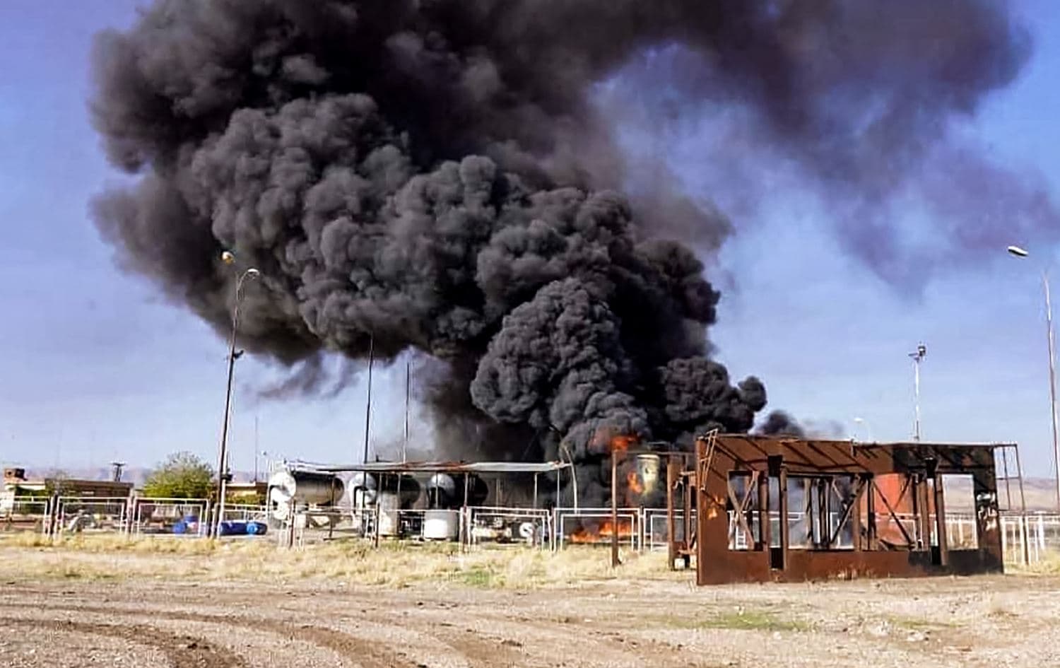 A fire raging at an unspecified hydrocarbon facility reportedly following a Turkish air strike on November 23, 2022 in the vicinity of Tal Awdah in northeastern Syria's Hasakah province. Photo:AFP/HO/Syrian State Television