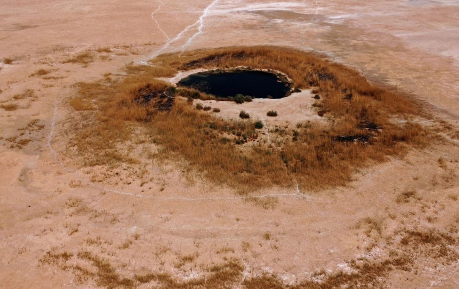 An aerial view of a pond remaining at the dried-up Sawa Lake in Iraq's southern province of al-Muthanna on April 19, 2022. Photo:AFP