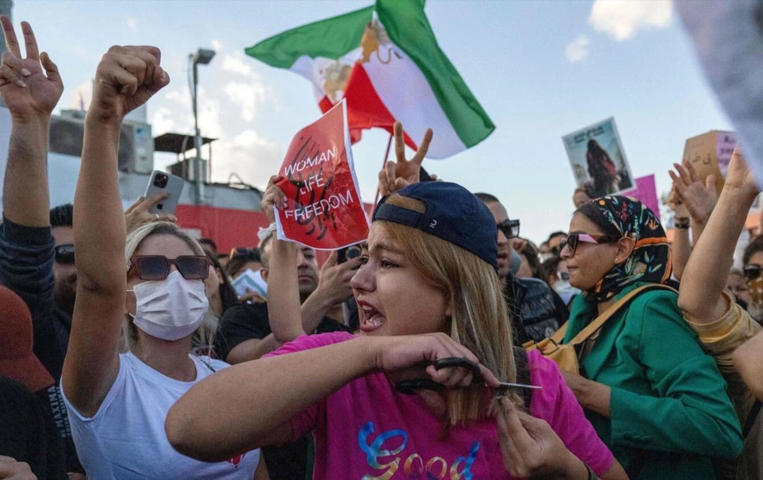 A protestor cuts her hair during a demonstration against the Iranian regime and in support of Iranian women in Istanbul, Turkey. Photo: AFP
