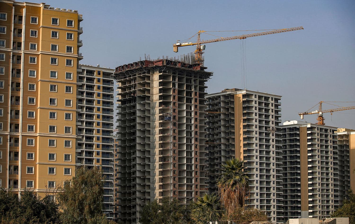 This picture taken on December 16, 2022 shows a view of unfinished apartment buildings at a housing complex in Iraq's capital Baghdad. Photo: Ahmad Al-Rubaye/AFP