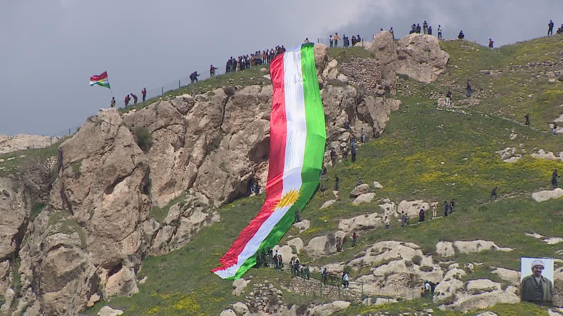 Flag of Kurdistan atop of Akre's mountains ahead of Newroz celebrations on March 20, 2023. Photo: Rudaw