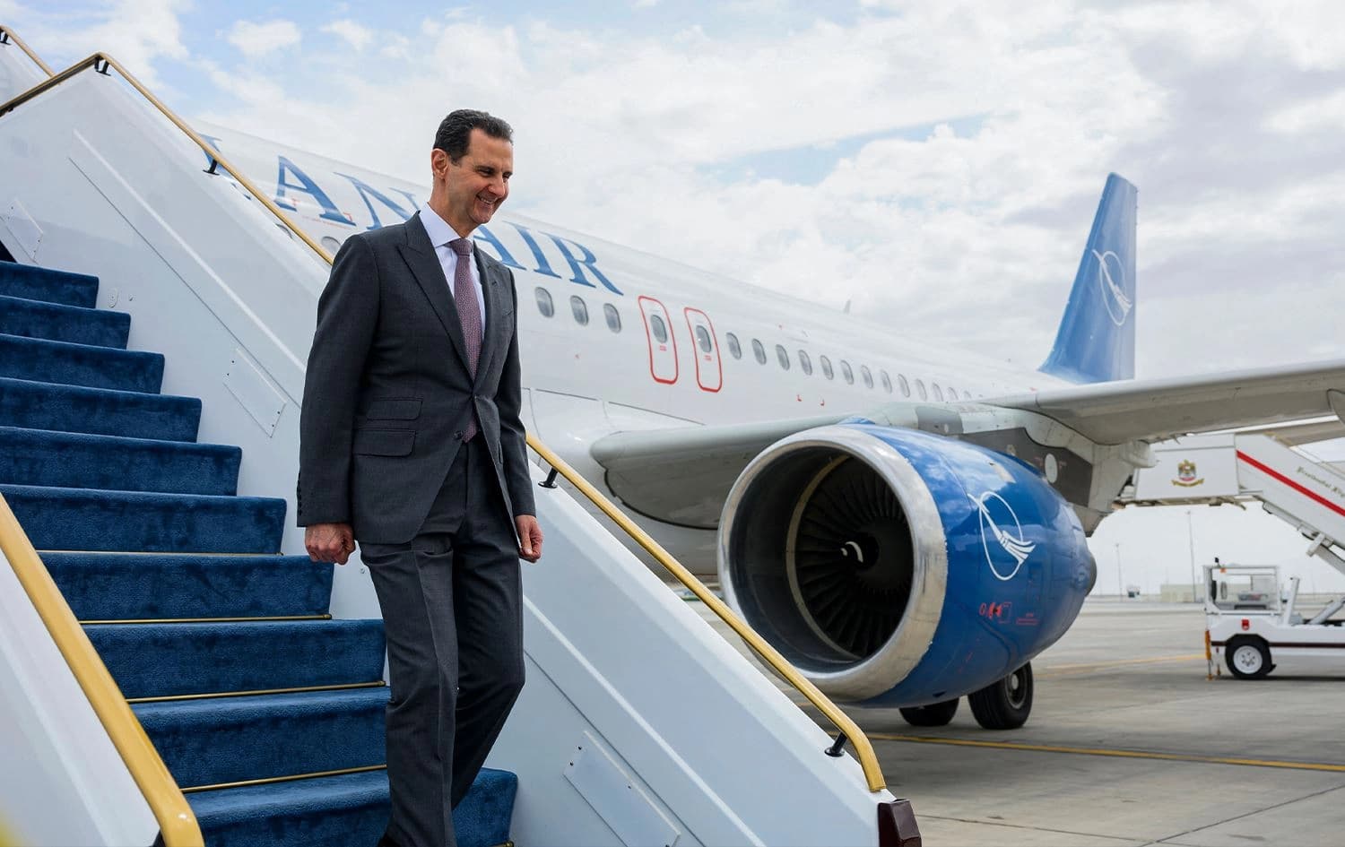 This handout image provided by the UAE Presidential court on March 19, 2023, shows Syrian President Bashar al-Assad disembarking upon arrival in Abu Dhabi. Photo: Abdulla al-Neyadi/UAE Presidential Court/AFP